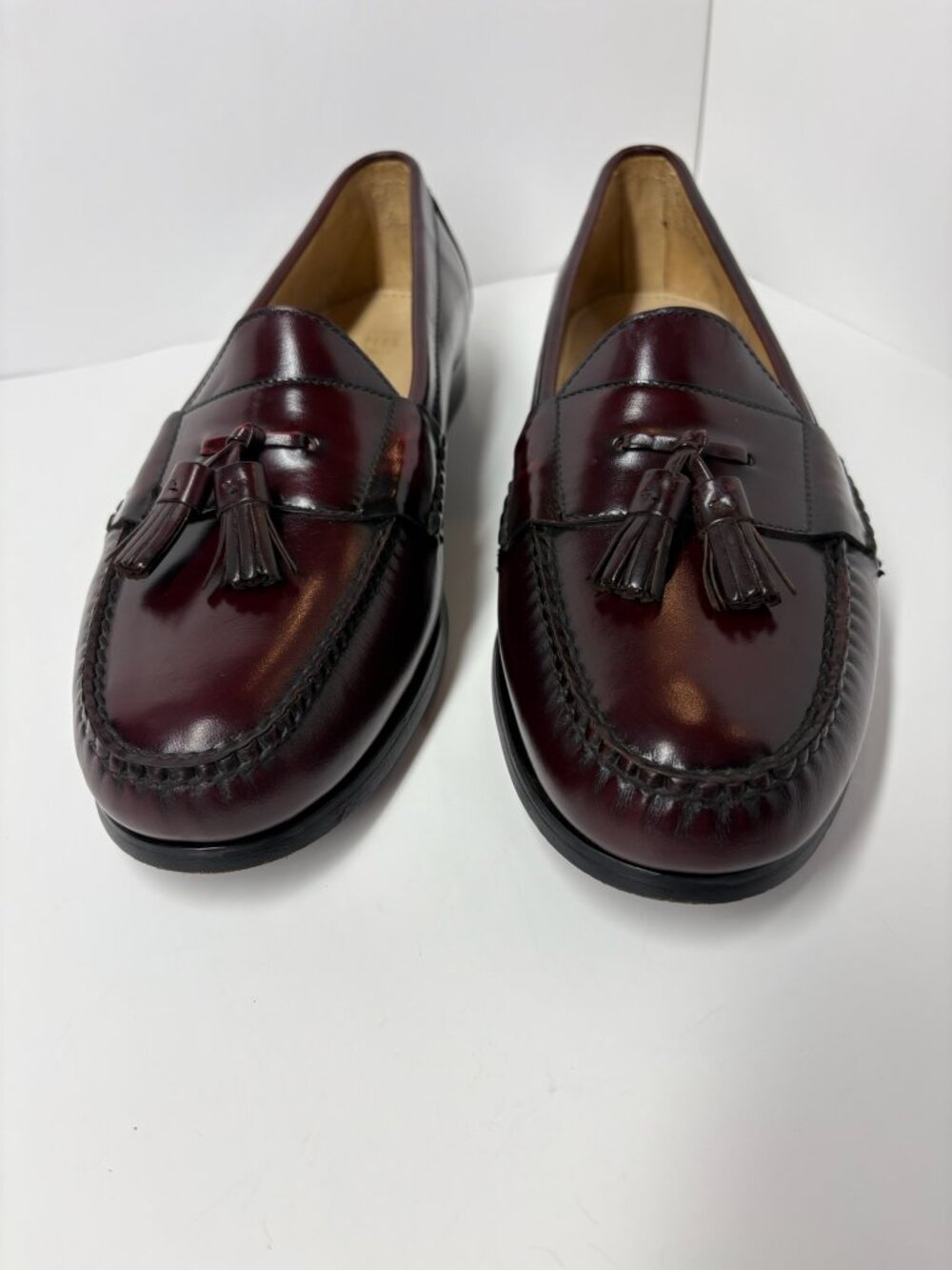 classic Cole Haan Pinch Tassel Loafers in a rich burgundy leather